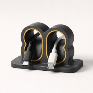 Тримач для кабелів із підставкою для телефона.